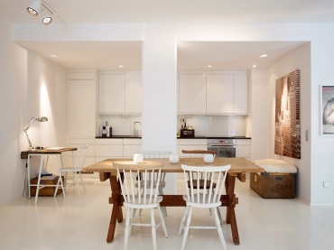 piękny i minimalistyczny przykład połączenia kilku pomieszczeń na jednej przestrzeni - to skandynawski salon razem z...