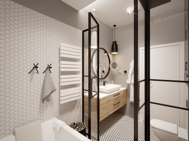 Czarne elementy w łazience przesądzają o jej charakterze, który jest zdecydowany i łączy elegancję z funkcjonalnością. Tym, co urozmaica znacznie przestrzeń łazienki, są geometryczne kafelki na ścianie oraz na...