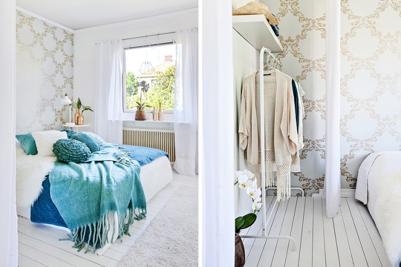 Stylowa tapeta na ścianie,białe deski na podłodze i turkusowa narzuta z poduszkami w aranżacji białej sypialni