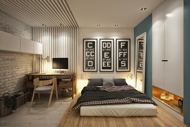 Biała cegła na ścianie w sypialni,tapeta ścienna w biało-szare paski,drewniane nowoczesne biurko i krzesło,materac na drewnianym podeście w sypialni