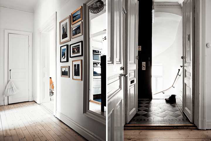 Jak urządzić biały i mały  przedpokój z drewnianą podłogą, dużym lustrem i galerią fotografii ?