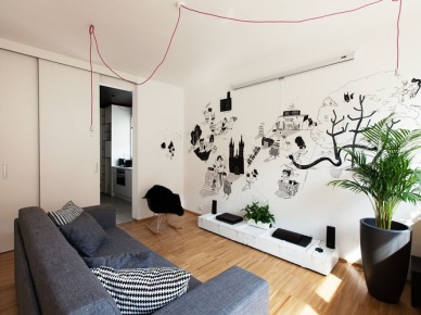 Nowoczesny salon z czarnymi grafikami, różowymi kablami z żarówkami i nowoczesnymi dodatkami (22277)