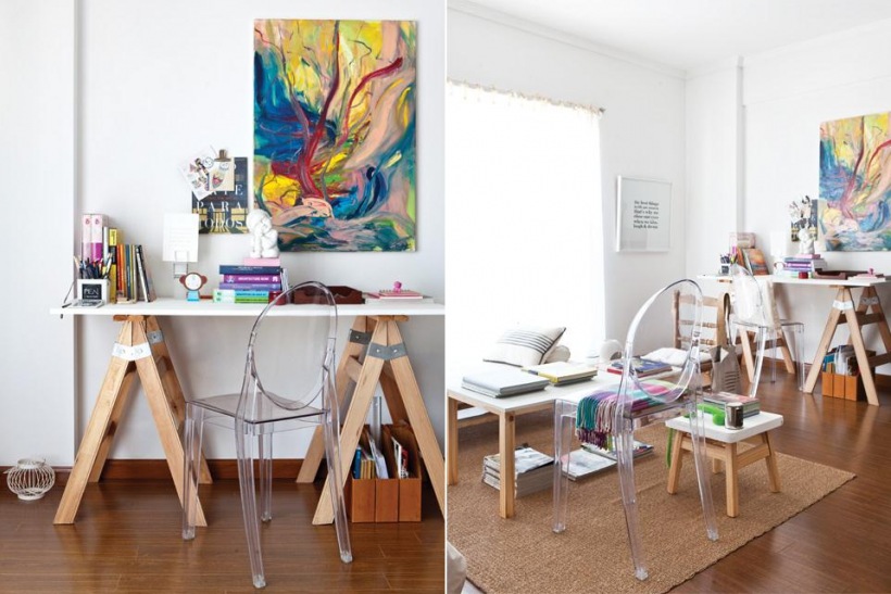 Skandynawskie biurko na kozlach, przexroczyste krzesło i nowoczesny kolorowy obraz