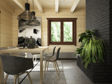 W jadalni nie tylko sufit, ale i pozostałe ściany wyłożone są jasnym drewnem. Naturalny materiał potęguje ciepło we...