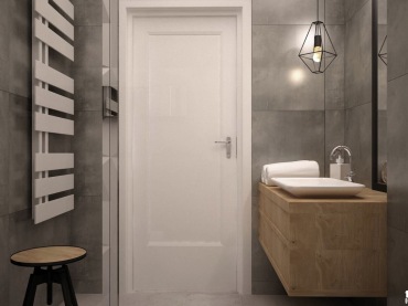 Szare ściany zapewniają surowy wymagający charakter minimalistycznego wnętrza. Łazienka z charakterystycznym...