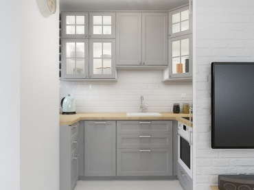 W małej kuchni dominuje biel i szarość, które wizualnie nieco powiększają ograniczoną przestrzeń. Dużą rolę w aranżacji...