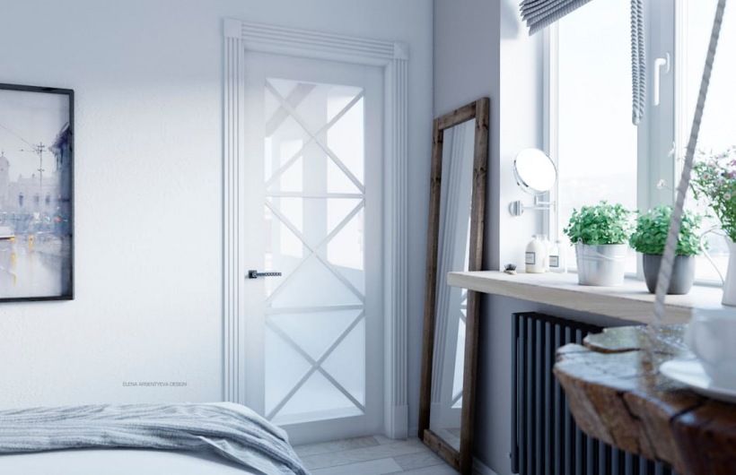 Oryginalne białe drzwi ze zdobieniem w aranżacji sypialni