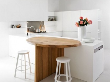 wspaniały i oryginalny projekt optymalnie urządzonej kuchni - idealnie biała z drewnianym, pomysłowym stołem - bardzo mi się podoba ten projekt, pomysł i styl...