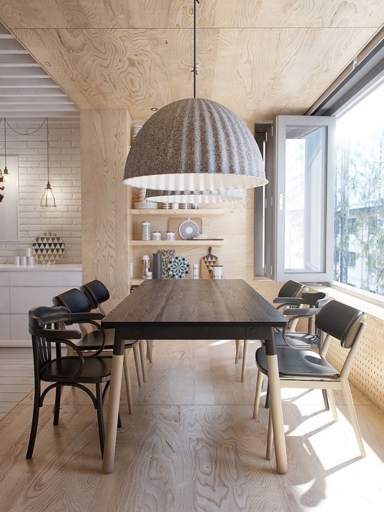 Skandynawski drewniany stół z czarnym blatem,wyplatane lampy,drewniana zabudowa z półkami w aranżacji skandynawskiej jadalni