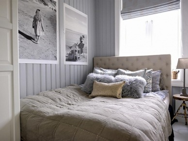 Pikowane łóżko,czarno-białe fotografie,futerkowe poduszki i industrialny stołek przy łóżku (23951)
