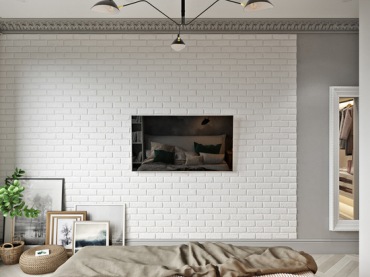 Wyjątkowo ciekawie prezentuje się ściana naprzeciw łóżka. Zawieszono tutaj tylko telewizor, ale białe cegły jako tło...