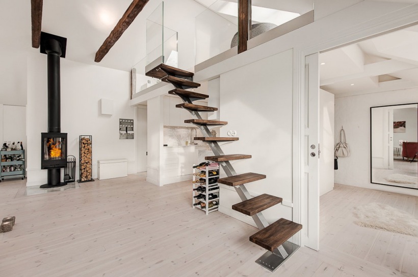 Nowoczesne metalowo-drewniane schody w otwartej zabudowie mieszkania