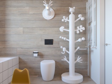 Drewniane panele na ścianie w łazience nawiązują do tych na podłodze. Tworzą jednolitą przestrzeń, która wzbogaca...