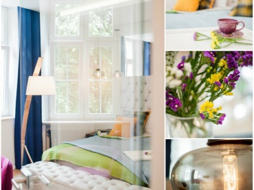 W białej i wysokiej sypialni zastosowano sporo różnokolorowych dodatków. Żółte poduszki na łóżku, zielony pled czy fioletowe kwiaty upiększają wnętrze, wpływając istotnie na jego...