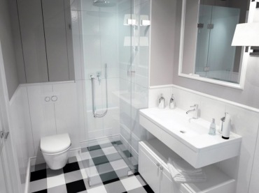 Płytki w łazience biało-czarne tworzace kratę sa fenomenalne. Szare ściany gaszą orginalna podłogę.