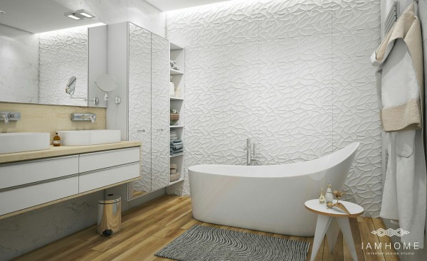 Strukturalne białe ściany, wolnostojąca wanna i nowoczesne szafki w łazience