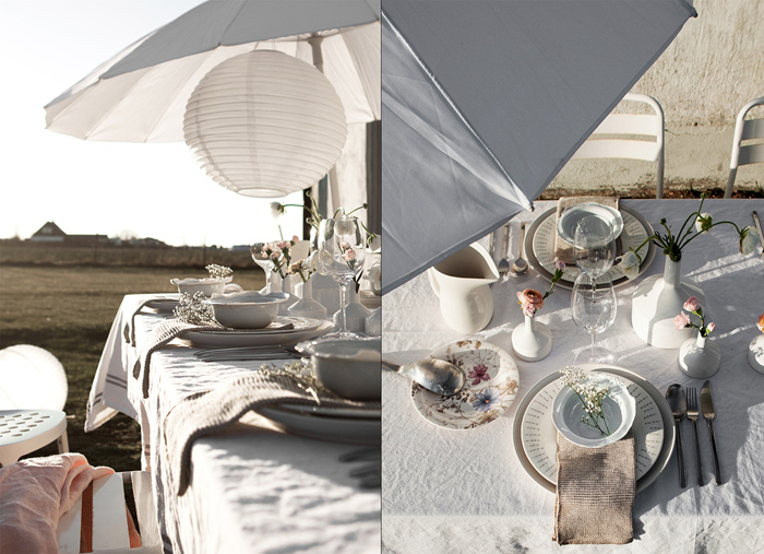 Letnia aranżacja stołu z parasolem na tarasie skandynawskim