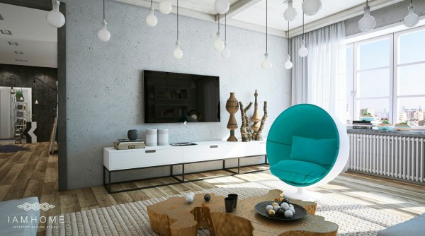 Biały fotel muszla z turkusową tapicerką,nowoczesne szafki pod telewizor i złocony pieniek w roli stolika w salonie